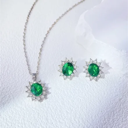 Green Stone Zircon Pendant Set  Add a pop of sparkle to your everyday look with this lightweight silver-tone pendant set featuring a dazzling green crystal and matching stud earrings. Perfect for casual to festive wear!  Silver pendant set with oval green zircon stone and matching stud earrings for women