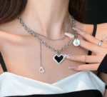 Twin Mosaic Love Necklace with dual heart pendants in stainless steel layered design