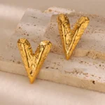 Vogue V Statement Earrings in gold with hammered texture and V-shaped bold design