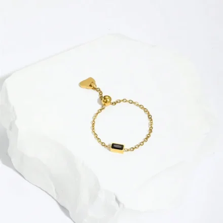 Dreamy Black Ring featuring a delicate 18K gold-plated chain band with a sleek black stone accent