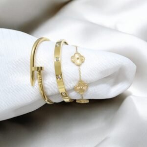 Elegant gold-plated charm bracelet with delicate round charms and cubic stones on wrist