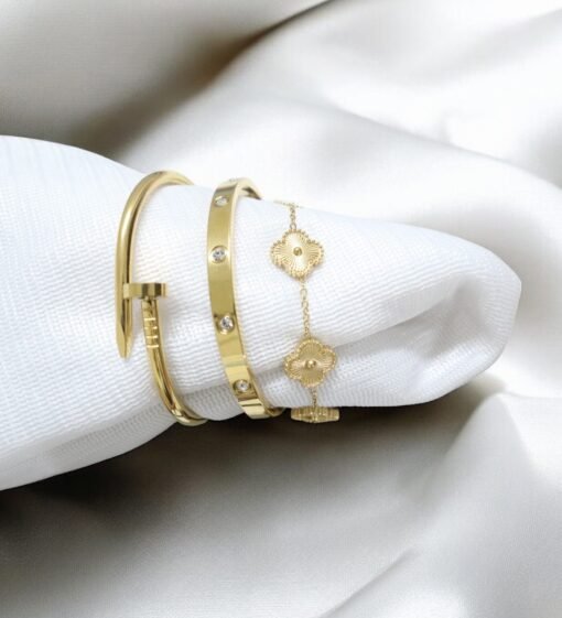 Elegant gold-plated charm bracelet with delicate round charms and cubic stones on wrist