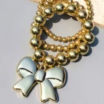 Bowknot Bracelet Stack Beads Jewellery Gold beaded bracelet stack with glossy bowknot charm for women