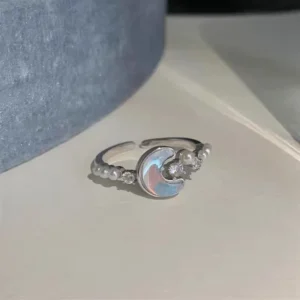 "Elegant silver adjustable pearl moon ring with opal cubic zirconia accents."