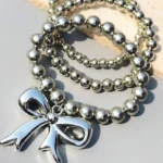 this elegant K Style Bow Bracelet Stack, inspired by the latest Korean fashion trends.